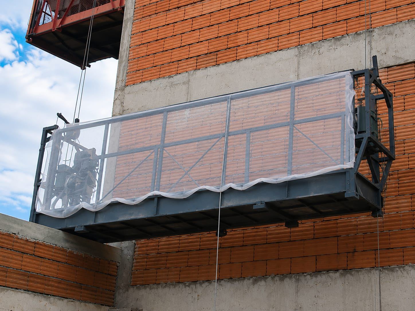 Balancim instalado em fachada de obra